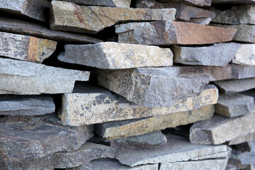 Textured layers of colorful stones create artistic wall design