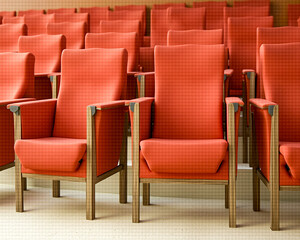 Obraz premium rows of red fabric chairs in a neat and organized arrangement.