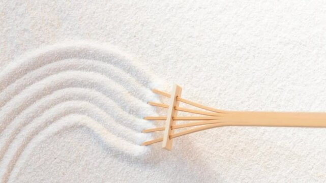Raking white sand