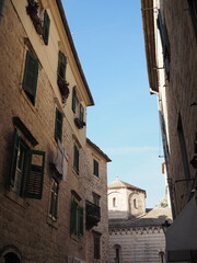 Narrow cozy sunny beige streets of Kotor, Montenegro, Balkans. Historical center of the old town