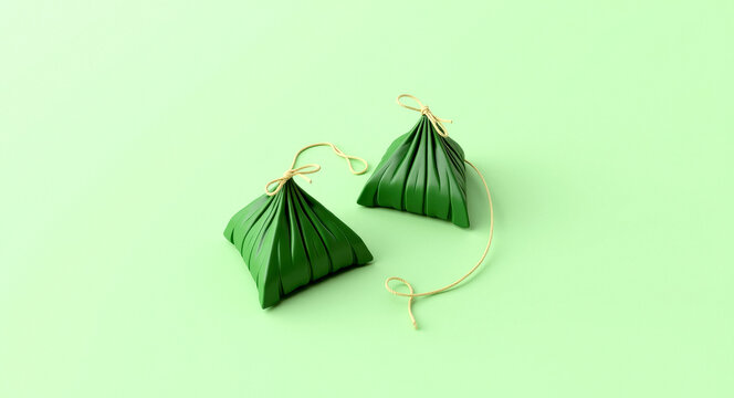 two small green parcels tied with string on a pale green background