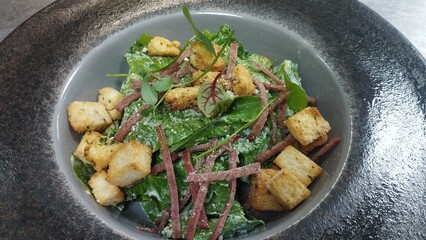 Fresh Caesar Salad Topped with Crunchy Croutons and Smoky Bacon