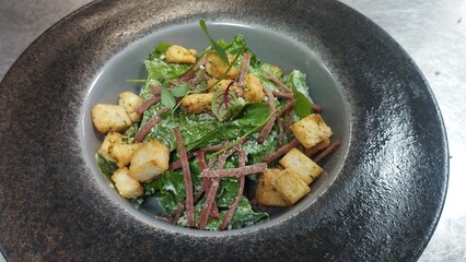 Fresh Caesar Salad Topped with Crunchy Croutons and Smoky Bacon