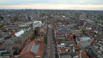Stunning aerial footage of Koninklijk Paleis - the royal palace in Amsterdam showcasing its iconic architecture, and vibrant cityscape. 