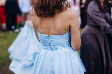 High school graduates dancing on prom, waltz and classical ball slow dance in dresses and suits on...