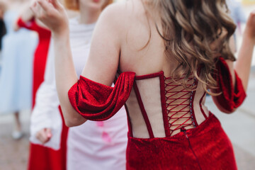 High school graduates dancing on prom, waltz and classical ball slow dance in dresses and suits on...