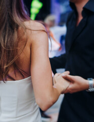 High school graduates dancing on prom, waltz and classical ball slow dance in dresses and suits on...