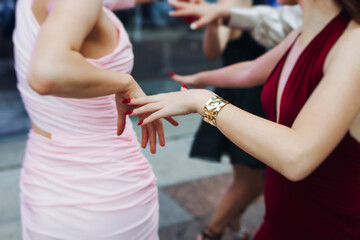 High school graduates dancing on prom, waltz and classical ball slow dance in dresses and suits on...