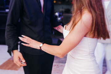 High school graduates dancing on prom, waltz and classical ball slow dance in dresses and suits on...