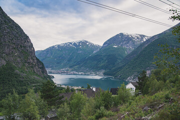 A scenic mountain valley with snowcapped peaks and tranquil waters, offering breathtaking views