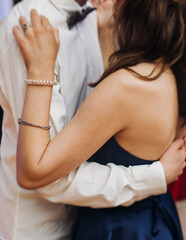 High school graduates dancing on prom, waltz and classical ball slow dance in dresses and suits on...