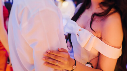 High school graduates dancing on prom, waltz and classical ball slow dance in dresses and suits on...
