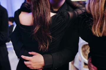 High school graduates dancing on prom, waltz and classical ball slow dance in dresses and suits on...