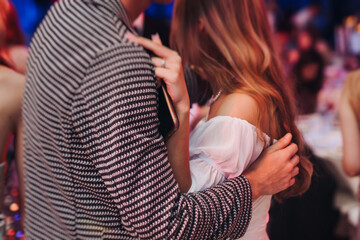 High school graduates dancing on prom, waltz and classical ball slow dance in dresses and suits on...