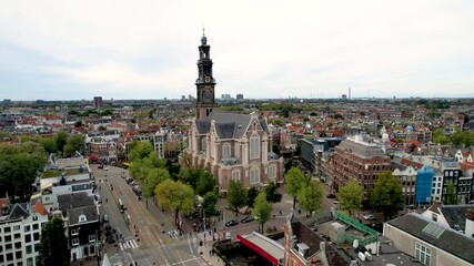 Stunning aerial footage of Westerkerk, the Protestant church in Amsterdam showcasing its iconic architecture, and vibrant cityscape.