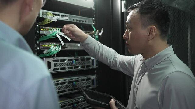 asian engineer working in datacenter