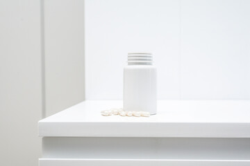 A jar of biotin dietary supplement on a white background