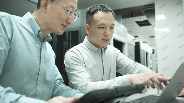 asian engineer working in datacenter