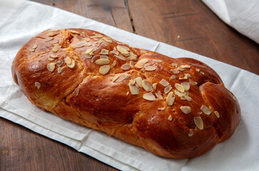 Easter sweet bread, homemade tsoureki braid on white table cloth