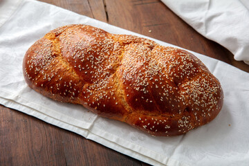 Easter sweet bread, homemade tsoureki braid on white table cloth