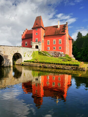 Obraz premium Romantic red castle on an island on a lake in Bohemia
