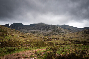 A summer HDR landscape image of Coire nan Ceum and Sail an Im with low cloud above on the Isle of Arran, Scotland. 