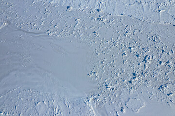 Aerial view of a frozen lake, sea water with snow, Prince Edward Island Canada.
