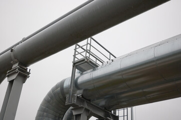 gray pipeline against gray sky