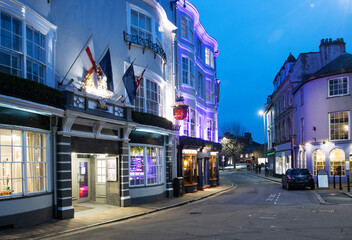Bars, cafes and restaurants illuminated at dusk in Barnstaple in Devon