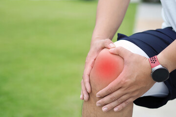 Knee Pain. Young man suffering from knee pain.