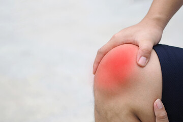 Knee Pain. Young man suffering from knee pain.