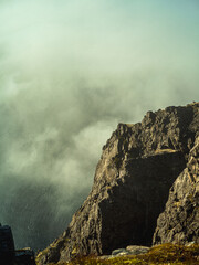 Clouds rolling over cliffs in Nordkapp in Norway