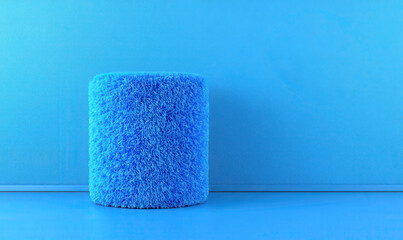 Soft Blue Cylinder Stool with Textured Fur on a Solid Blue Background for Modern Home Decor and Interior Design Inspiration