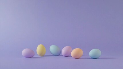Colorful pastel eggs arranged on a light purple background for a festive celebration or seasonal decoration