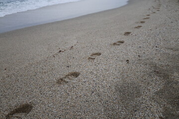 Footprints sandy beach. High quality photo