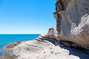 landscape of the bizarre white rocks and the blue sea of ​​the Sardinian coast