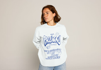 Young Woman With Curly Hair Wearing a Sweater Poses for Mockup. PSD mockup ready to insert your design and change the color