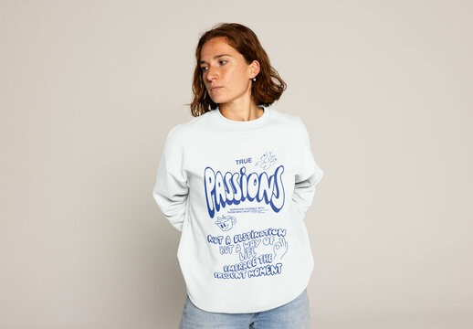 Young Woman With Curly Hair Wearing a Sweater Poses for Mockup. PSD mockup ready to insert your design and change the color