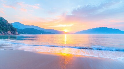 Obraz premium Serene sunrise over coastal mountains, calm waves on sandy beach; travel, vacation backdrop