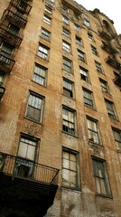 Obraz premium Old city apartment building, exterior, urban decay, low angle