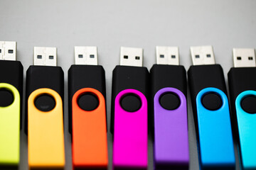 closeup of Lined up usb flash drives on white background