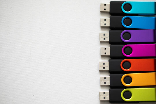 colorful rainbow usb flash drives on white background