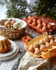 Easter white wooden table with eggs, Easter cake