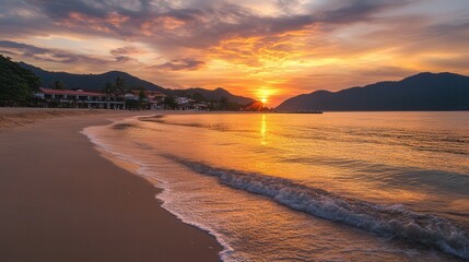 Obraz premium A picturesque sunset illuminates a tranquil beach, with gentle waves lapping at the shore and distant houses silhouetted against the colorful sky.