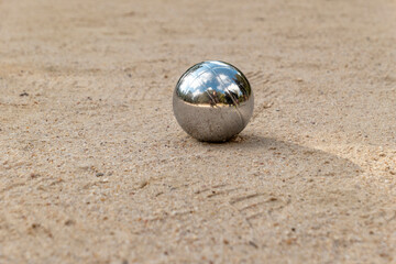 boccia ball in silver on the beach
