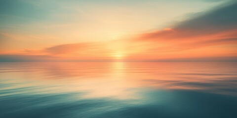 Fototapeta premium Serene sunset over water casts warm colors across sky