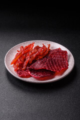 Dried beef slices, jerky, with cherry or plum flavor, salt and spices