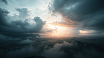 Dramatic skies and ethereal light create a breathtaking vista over the distant hills in this landscape view.