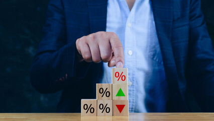 Financial, stocks, interest rate and GDP percent change, wooden block with percentage sign and...