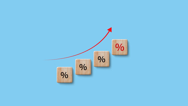 Financial, stocks, interest rate and GDP percent change, wooden block with percentage sign and arrow up sign for interest rate, ranking